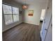 Living room with a large window, modern lighting, and wood flooring at 1600 Long Grove Dr # 628, Mount Pleasant, SC 29464