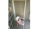 Cozy screened patio area furnished with a chair and views of the building at 1600 Long Grove Dr # 628, Mount Pleasant, SC 29464