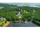 Aerial view of a luxurious home by the lake at 769 Bulls Bay Blvd, Awendaw, SC 29429