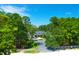 Luxury home nestled in a wooded area with a long driveway at 769 Bulls Bay Blvd, Awendaw, SC 29429