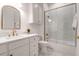 Bright bathroom with white cabinets, a shower, and marble tile at 769 Bulls Bay Blvd, Awendaw, SC 29429