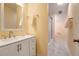 Bright bathroom with white vanity, a shower, and a peach color scheme at 769 Bulls Bay Blvd, Awendaw, SC 29429