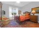 Charming bedroom with a cozy sitting area and hardwood floors at 769 Bulls Bay Blvd, Awendaw, SC 29429