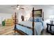Serene bedroom with a four-poster bed and hardwood floors at 769 Bulls Bay Blvd, Awendaw, SC 29429