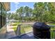 Deck with built-in grill and view of the pool and lake at 769 Bulls Bay Blvd, Awendaw, SC 29429