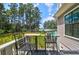 Deck overlooking backyard with lake view and seating area at 769 Bulls Bay Blvd, Awendaw, SC 29429
