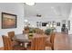 Bright dining area with round table and woven chairs, open to living room at 769 Bulls Bay Blvd, Awendaw, SC 29429