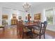 Elegant dining room featuring a large table, chandelier, and hardwood floors at 769 Bulls Bay Blvd, Awendaw, SC 29429