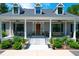 Gray house with front porch and landscaping at 769 Bulls Bay Blvd, Awendaw, SC 29429