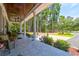 Spacious front porch with seating and wooded views at 769 Bulls Bay Blvd, Awendaw, SC 29429