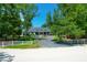 Gray house with white fence and long driveway at 769 Bulls Bay Blvd, Awendaw, SC 29429