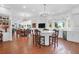 Open concept kitchen with island, white cabinetry, and hardwood floors at 769 Bulls Bay Blvd, Awendaw, SC 29429