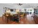 Spacious living room with hardwood floors, built-in shelving, and a ceiling fan at 769 Bulls Bay Blvd, Awendaw, SC 29429