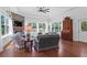 Living room with stone fireplace, hardwood floors and water views at 769 Bulls Bay Blvd, Awendaw, SC 29429