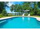 Relaxing pool area with lake view and lounge chairs at 769 Bulls Bay Blvd, Awendaw, SC 29429