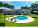 Inviting kidney-shaped pool with surrounding patio at 769 Bulls Bay Blvd, Awendaw, SC 29429