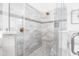 Large walk-in shower with marble tile and glass enclosure at 769 Bulls Bay Blvd, Awendaw, SC 29429