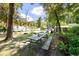 Large backyard with a picnic table surrounded by lush green trees and RV parking at 2991 Blackfish Rd, Johns Island, SC 29455