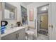 Bathroom features modern vanity, toilet and a view of laundry area at 2991 Blackfish Rd, Johns Island, SC 29455