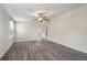 Bright bedroom with a ceiling fan, neutral paint, and wood-look floors at 2991 Blackfish Rd, Johns Island, SC 29455