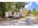 Inviting single-story home with a ramp, complemented by lush landscaping and a spacious driveway at 2991 Blackfish Rd, Johns Island, SC 29455