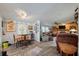 Open-concept living room featuring wood flooring, dining area, and comfortable seating at 2991 Blackfish Rd, Johns Island, SC 29455