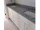 Bathroom features granite countertop, white cabinets, and dual sinks at 108 S Williams Dr, Moncks Corner, SC 29461