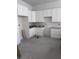 Unfinished kitchen with white cabinets, granite countertops, and space for modern appliances at 108 S Williams Dr, Moncks Corner, SC 29461