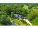 Stunning aerial view of a home with lush greenery and adjacent to a manicured golf course at 10 Trail Hollow Dr, Charleston, SC 29414