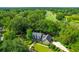 Gorgeous home surrounded by mature trees and lush greenery, next to a golf course at 10 Trail Hollow Dr, Charleston, SC 29414