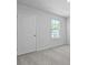Neutrally painted bedroom features a large window with white trim and plush gray carpeting at 2172 Macallan Blvd, Ravenel, SC 29470