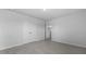 Empty bedroom with plush gray carpeting, double-door closet, and access to another room at 2172 Macallan Blvd, Ravenel, SC 29470