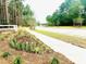 The entrance is lined with manicured landscaping and a paved walkway at 2172 Macallan Blvd, Ravenel, SC 29470
