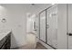 Modern bathroom with a glass-enclosed shower and a view to the main bedroom at 423 Grove End Rd, Moncks Corner, SC 29461