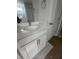 Bathroom vanity features white cabinets, modern sink, and an elegant mirror at 423 Grove End Rd, Moncks Corner, SC 29461