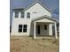 Rear exterior of the two-story home showcasing the covered patio and white siding at 423 Grove End Rd, Moncks Corner, SC 29461