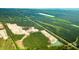 Aerial view of a new home community in development, surrounded by lush greenery at 5536 Bowmore Blvd, Ravenel, SC 29470