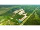 An aerial view displays new homesites surrounded by mature trees and ponds throughout the community at 5536 Bowmore Blvd, Ravenel, SC 29470
