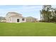 The backyard features a well-maintained lawn and easy access to the house at 5536 Bowmore Blvd, Ravenel, SC 29470