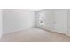 Bedroom with neutral carpet, white trim, a window overlooking the neighborhood, and ample natural light at 5568 Bowmore Blvd, Ravenel, SC 29470