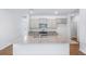 Open kitchen with gray cabinets, stainless steel appliances, and a granite island at 5568 Bowmore Blvd, Ravenel, SC 29470