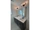 Modern bathroom with double vanity, large mirror, and gray cabinets at 100 Gray Pine Ln, Summerville, SC 29483