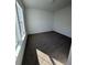 Well-lit bedroom with wall-to-wall carpeting and large window at 100 Gray Pine Ln, Summerville, SC 29483