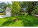 The detached two-car garage offers ample space and is surrounded by lush greenery and mature trees at 100 Gray Pine Ln, Summerville, SC 29483
