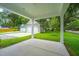 View from the front porch highlights the spacious two-car detached garage and extra parking at 100 Gray Pine Ln, Summerville, SC 29483
