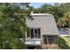 Exterior view of a home with an open-air balcony offering natural light and a welcoming entrance at 1616 Live Oak Park, Seabrook Island, SC 29455