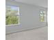Bedroom boasting natural light from two windows, enhancing its spacious feel at 183 Morning View Way, Moncks Corner, SC 29461