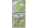 Window view showcasing lush greenery and natural light filtering through at 183 Morning View Way, Moncks Corner, SC 29461