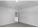 A minimalist bedroom boasts neutral carpet, clean walls, and an open doorway for accessibility at 355 Willows Crescent Dr, Moncks Corner, SC 29461