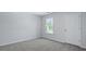 Bright bedroom with a neutral colored walls and carpet at 355 Willows Crescent Dr, Moncks Corner, SC 29461